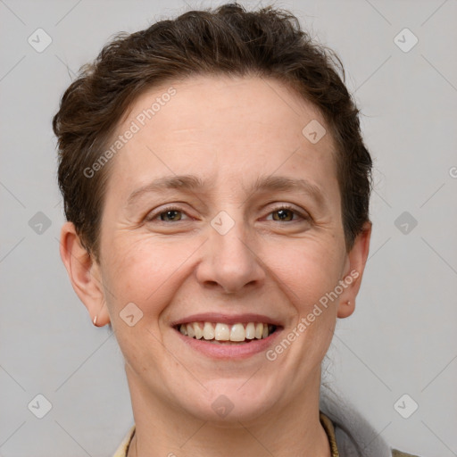 Joyful white adult female with short  brown hair and grey eyes