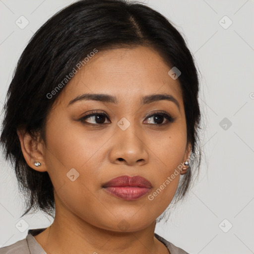 Joyful latino young-adult female with medium  brown hair and brown eyes