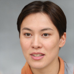 Joyful asian young-adult female with short  brown hair and brown eyes