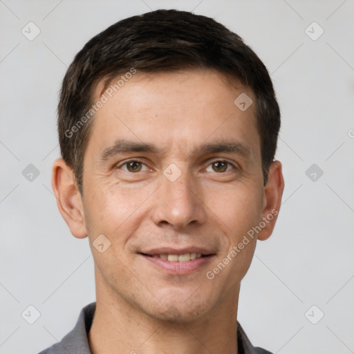 Joyful white young-adult male with short  brown hair and brown eyes