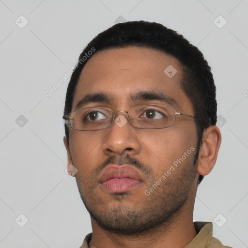 Neutral black young-adult male with short  black hair and brown eyes