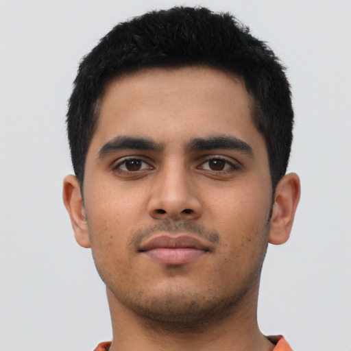 Neutral latino young-adult male with short  black hair and brown eyes