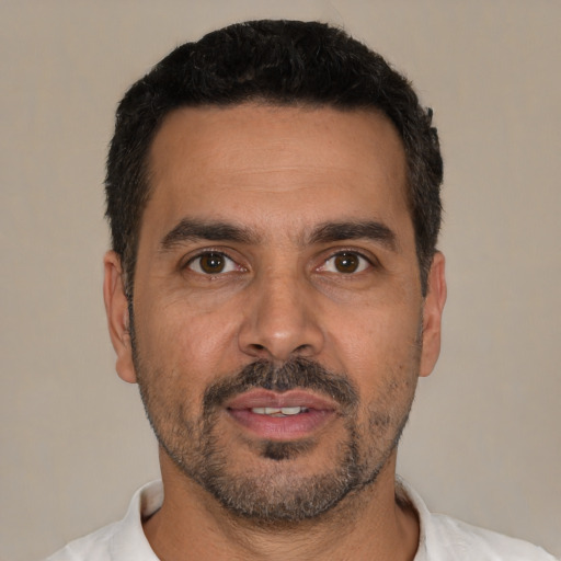 Neutral white adult male with short  black hair and brown eyes