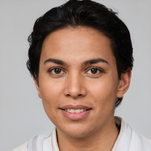 Joyful white young-adult female with short  brown hair and brown eyes