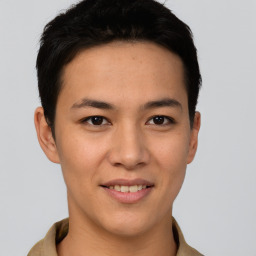 Joyful asian young-adult male with short  brown hair and brown eyes