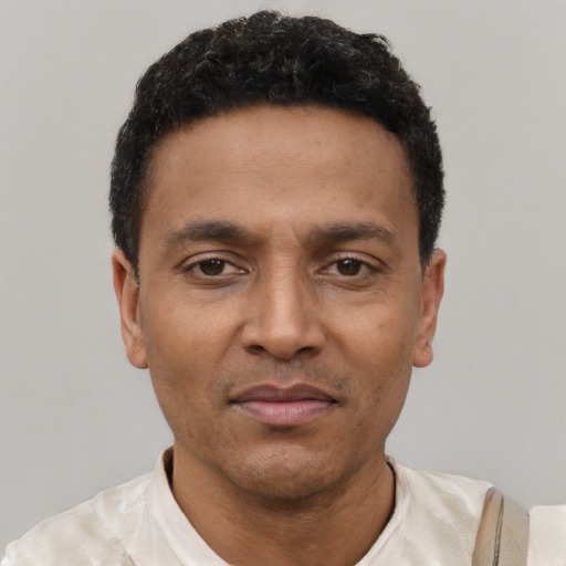 Neutral latino adult male with short  black hair and brown eyes