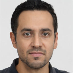 Neutral white young-adult male with short  black hair and brown eyes