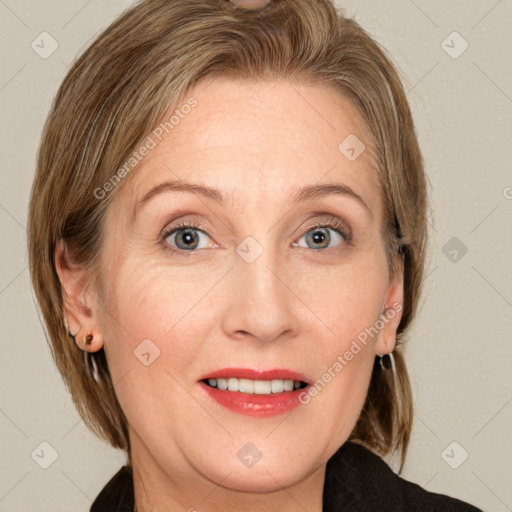 Joyful white adult female with medium  brown hair and grey eyes