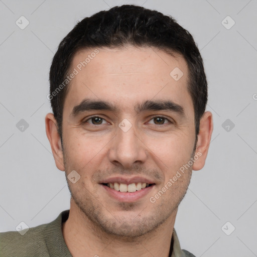 Joyful white young-adult male with short  black hair and brown eyes