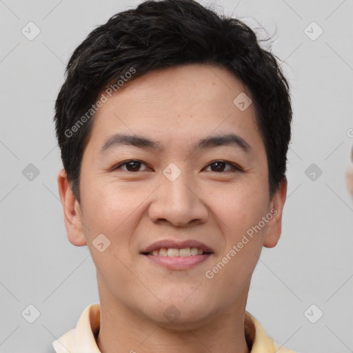 Joyful asian young-adult male with short  brown hair and brown eyes