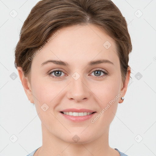 Joyful white young-adult female with short  brown hair and grey eyes