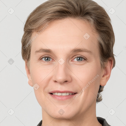 Joyful white adult female with short  brown hair and grey eyes