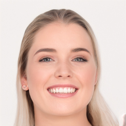 Joyful white young-adult female with long  brown hair and blue eyes