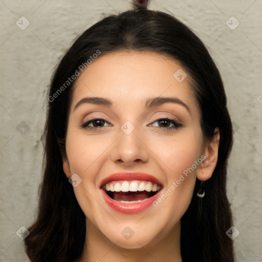 Joyful white young-adult female with long  black hair and brown eyes