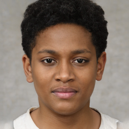 Joyful black child female with short  brown hair and brown eyes