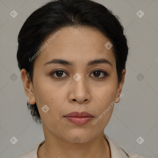 Joyful latino young-adult female with medium  brown hair and brown eyes