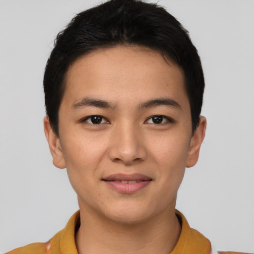 Joyful asian young-adult male with short  brown hair and brown eyes