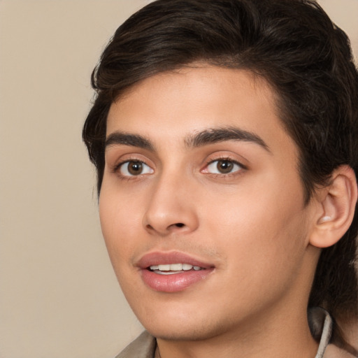 Joyful white young-adult male with medium  brown hair and brown eyes