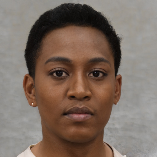 Neutral black young-adult female with short  brown hair and brown eyes
