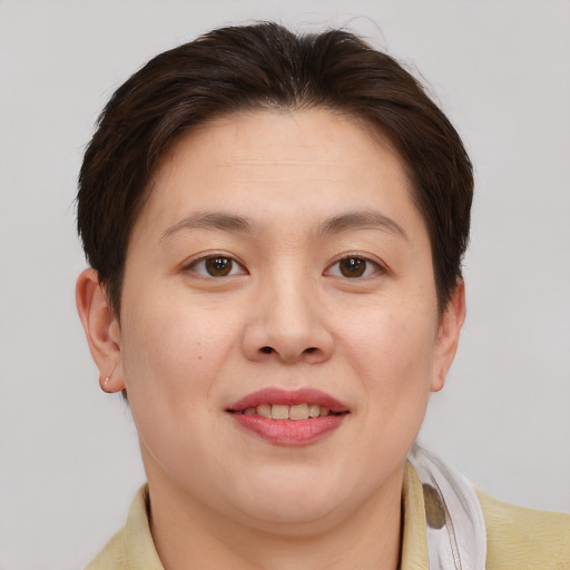 Joyful white young-adult female with short  brown hair and brown eyes