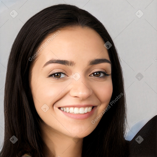 Joyful white young-adult female with long  black hair and brown eyes