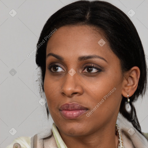 Joyful latino young-adult female with medium  black hair and brown eyes