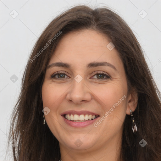 Joyful white adult female with long  brown hair and brown eyes