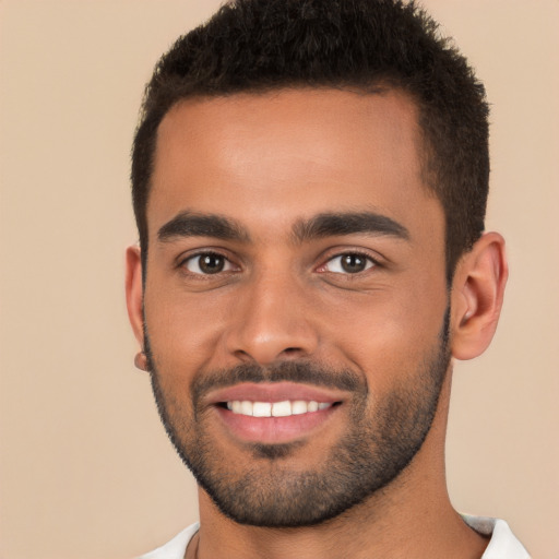 Joyful white young-adult male with short  black hair and brown eyes