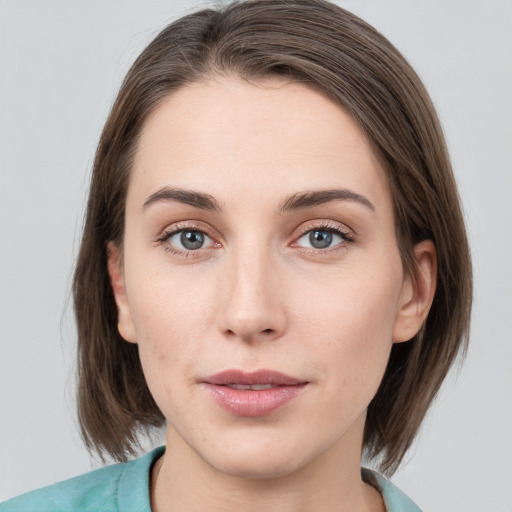 Neutral white young-adult female with medium  brown hair and grey eyes