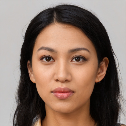 Neutral latino young-adult female with long  black hair and brown eyes