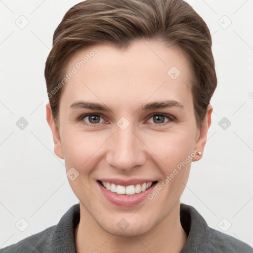 Joyful white young-adult female with short  brown hair and grey eyes