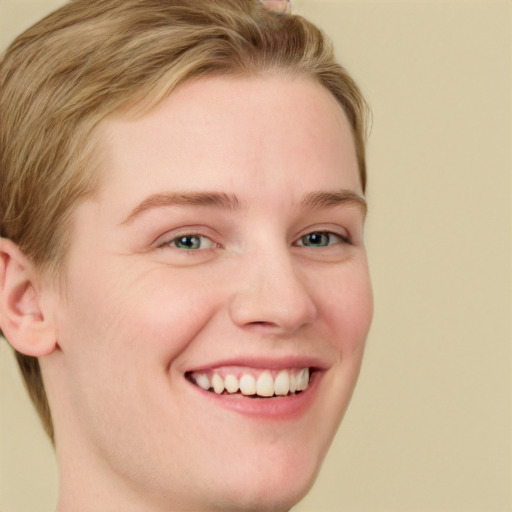 Joyful white young-adult female with short  brown hair and blue eyes