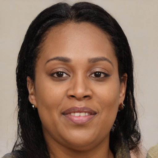 Joyful black young-adult female with medium  brown hair and brown eyes