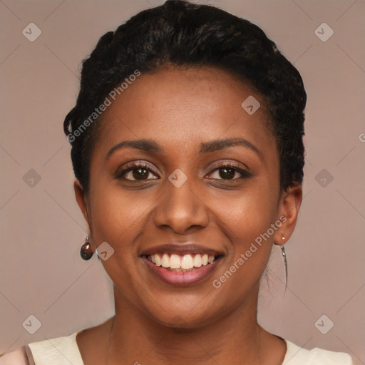 Joyful black young-adult female with short  black hair and brown eyes