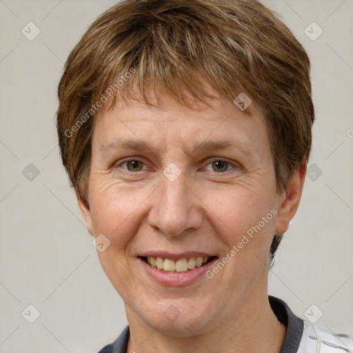 Joyful white adult female with short  brown hair and grey eyes