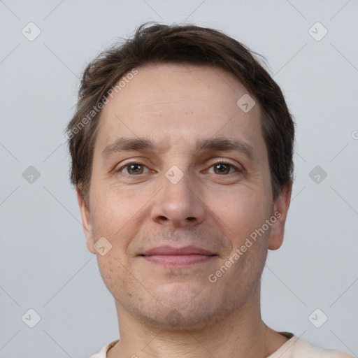 Joyful white adult male with short  brown hair and brown eyes