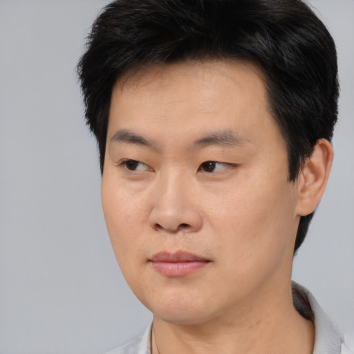Neutral asian young-adult male with short  brown hair and brown eyes