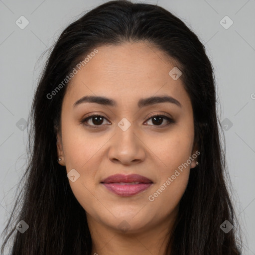 Joyful latino young-adult female with long  brown hair and brown eyes