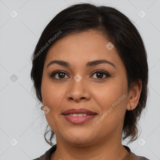 Joyful latino young-adult female with medium  brown hair and brown eyes