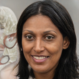 Joyful white adult female with medium  brown hair and brown eyes