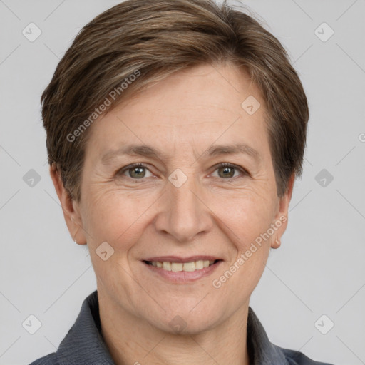 Joyful white adult female with short  brown hair and grey eyes