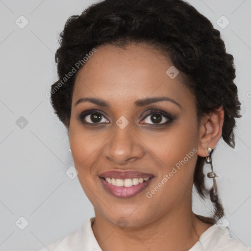 Joyful black young-adult female with medium  brown hair and brown eyes