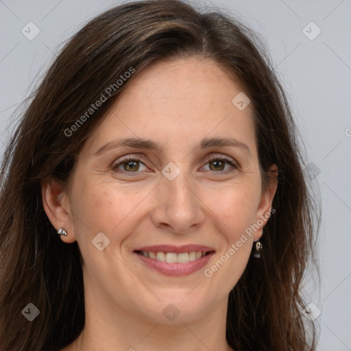 Joyful white adult female with long  brown hair and brown eyes