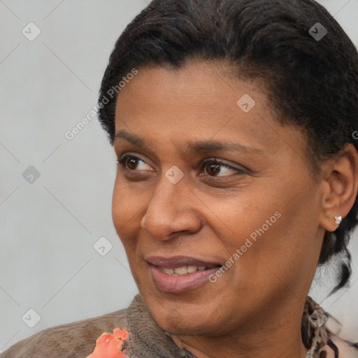 Joyful black adult female with short  brown hair and brown eyes