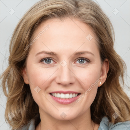 Joyful white young-adult female with medium  brown hair and blue eyes