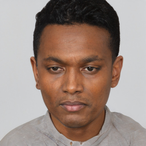 Neutral black young-adult male with short  black hair and brown eyes