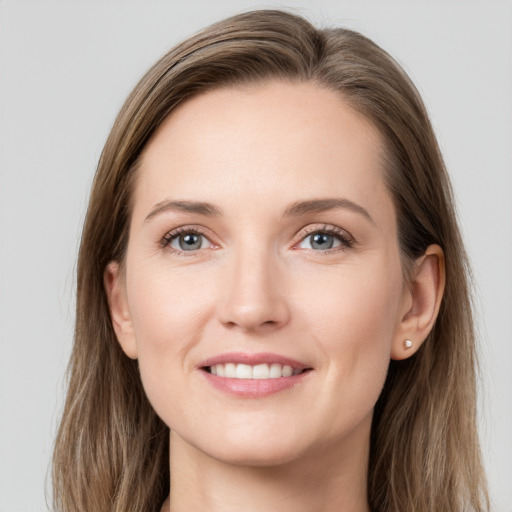 Joyful white young-adult female with long  brown hair and grey eyes