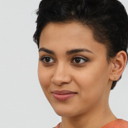 Joyful latino young-adult female with short  brown hair and brown eyes