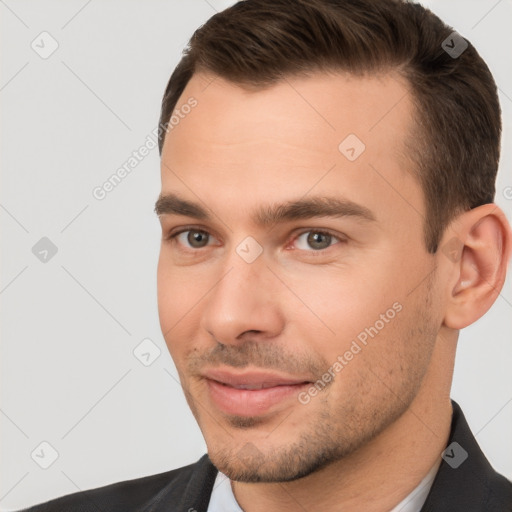 Joyful white young-adult male with short  brown hair and brown eyes