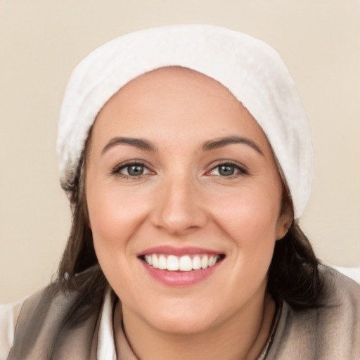 Joyful white young-adult female with medium  black hair and brown eyes